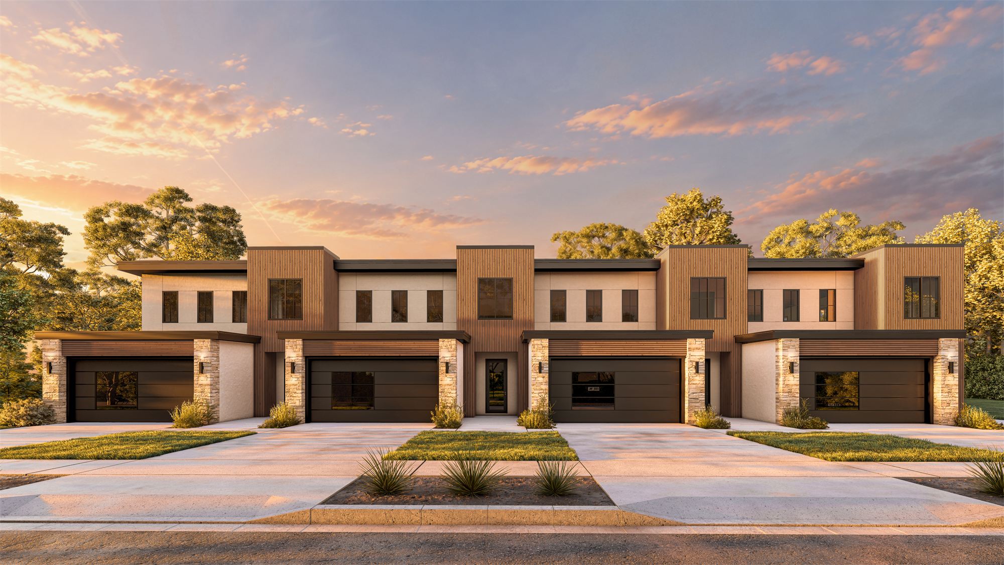 Davenport Townhouses at dusk: four townhouse units with wood-clad bays, stone bases, and garages